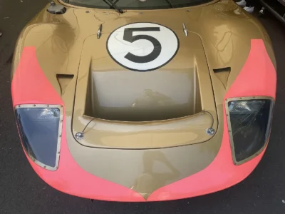 Close-Up Front View Of Gold And Pink Vintage Ford GT Race Car Number 5