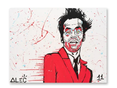 Abstract portrait painting of a man in a red suit and black tie, rendered with expressive black linework, red and pale blue accents, and scattered paint splatters across a white background