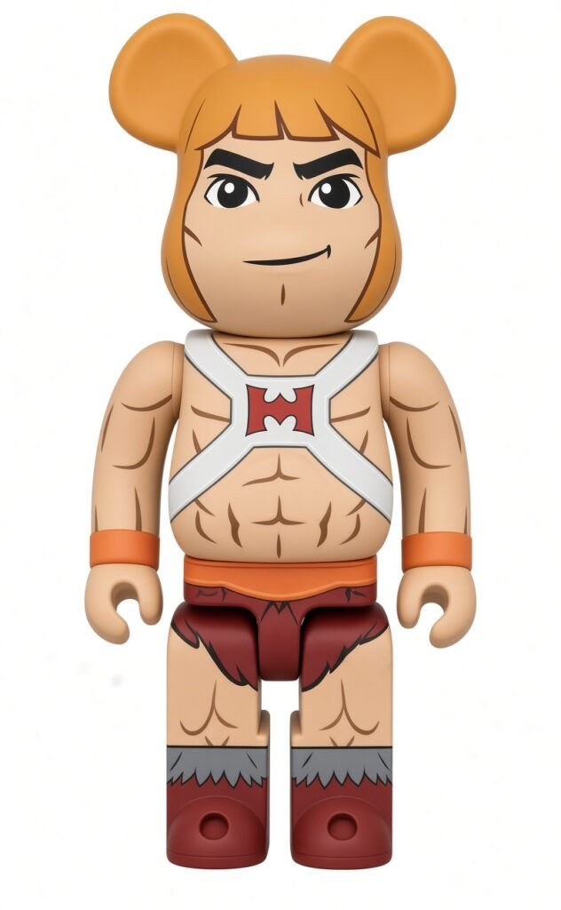 BE@RBRICK figure styled as a muscular He-Man character with orange hair, armor straps, loincloth, and red boots