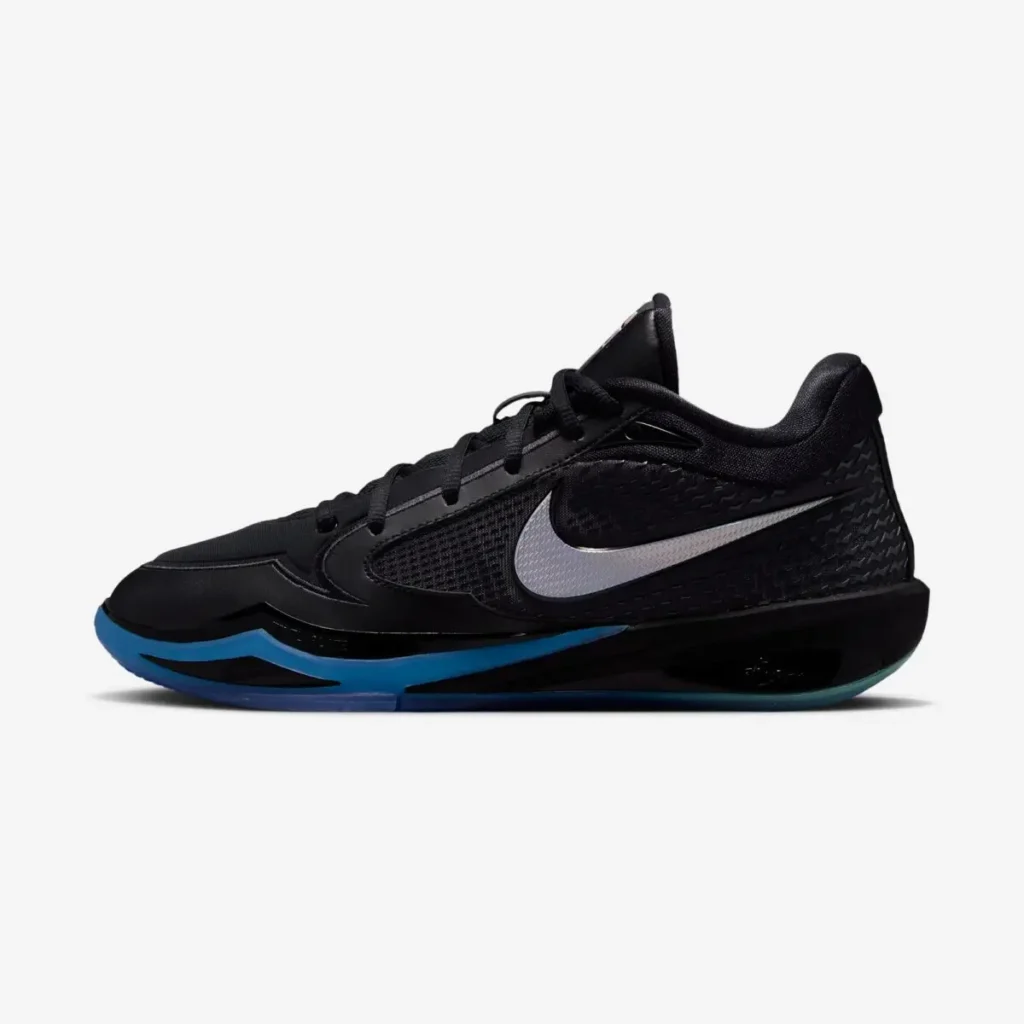 Side profile of a black Nike basketball shoe with an iridescent Swoosh and blue-to-teal outsole