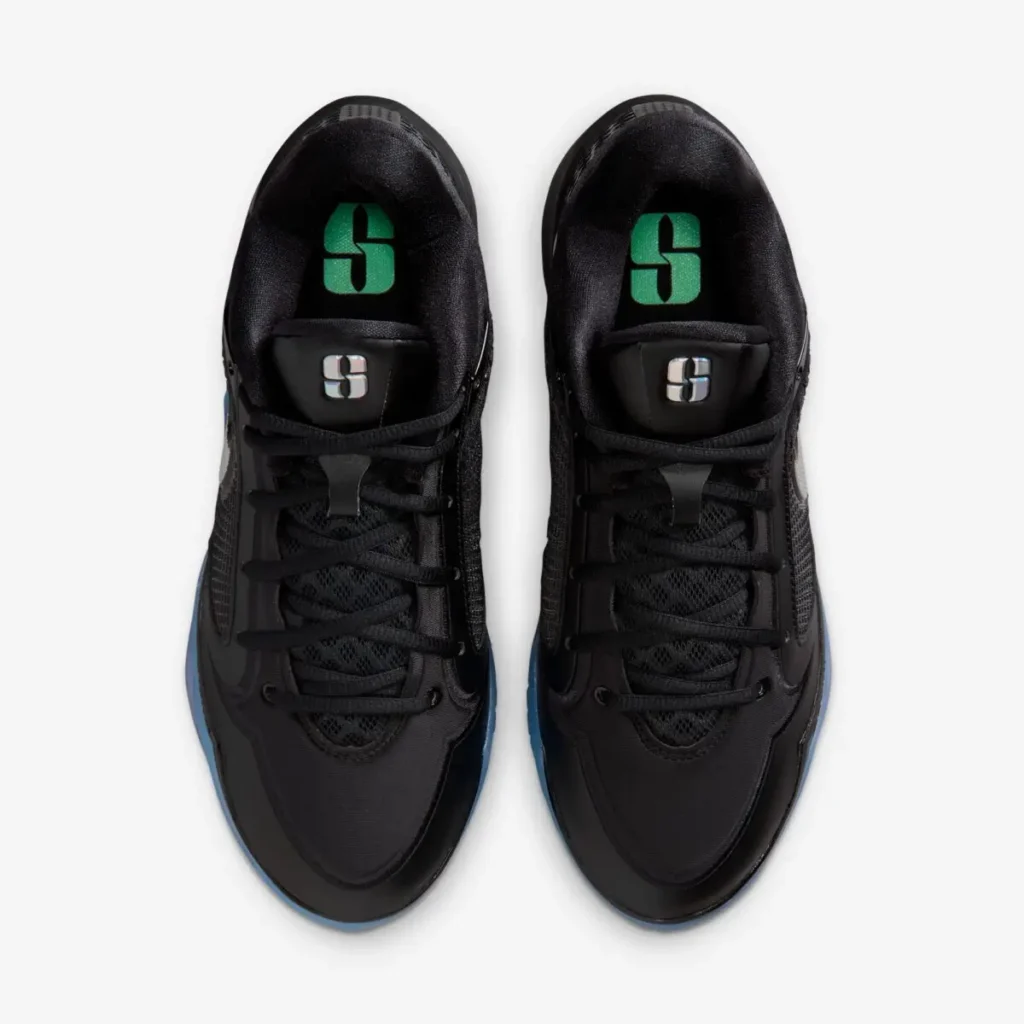 Top view of the pair show black laces, mesh tongues and green “S” graphics on the insole