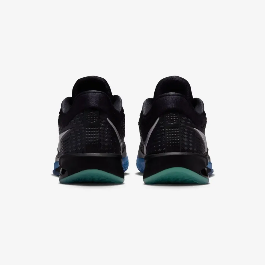 Rear view of the pair show texture black heels and teal outsole section