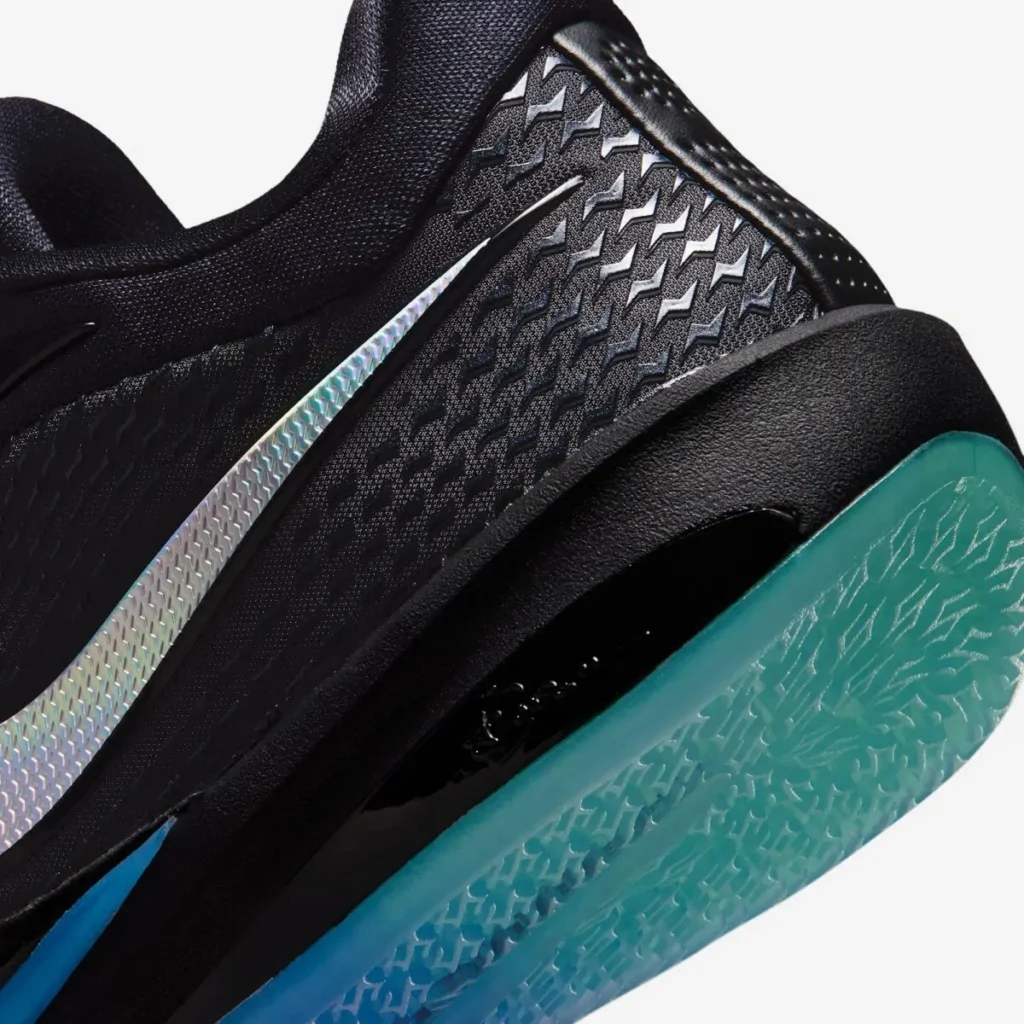 Close-up of the textured heel, metallic Swoosh and translucent teal outsole