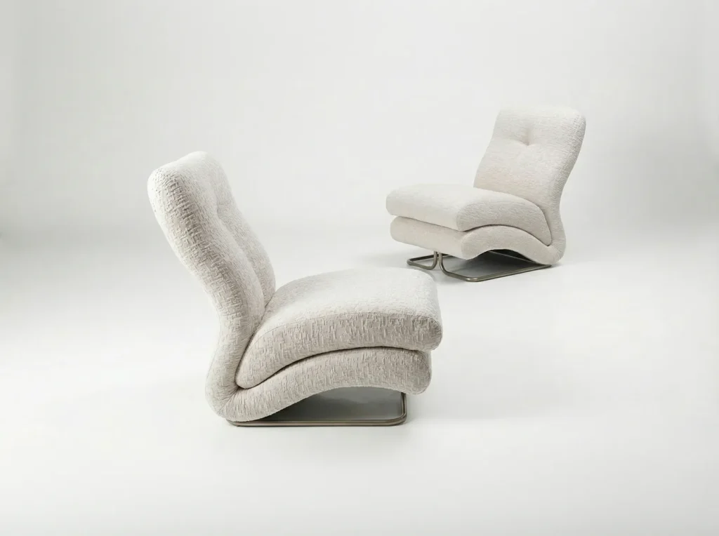 Two sculpture white upholster lounge chair with curved sil and metal sled base
