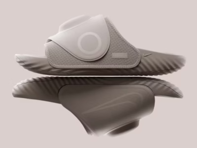 Nike Air Zoom Hyperslide recovery slide in light gray, shown in side profile with a mirrored reflection and sculpt sole