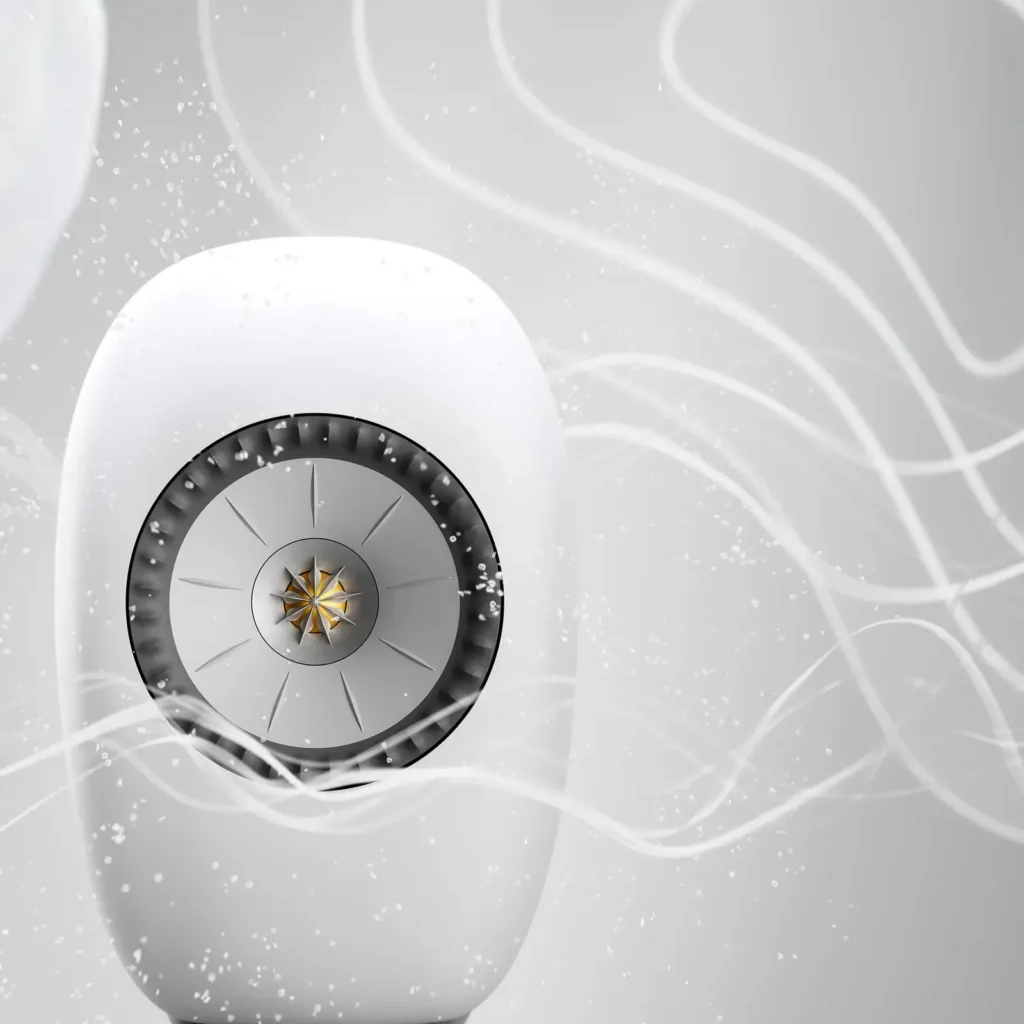 Close-up of a white KEF LSX II LT speaker with abstract white sound waves flowing across the frame, emphasizing immersive wireless audio show