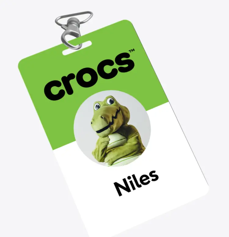 Green Crocs Employee Badge Featuring Brand Mascot Niles