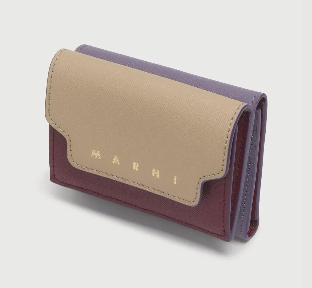 Compact tri-fold leather wallet in beige, burgundy, and lavender color-blocked panels with gold foil Marni brand