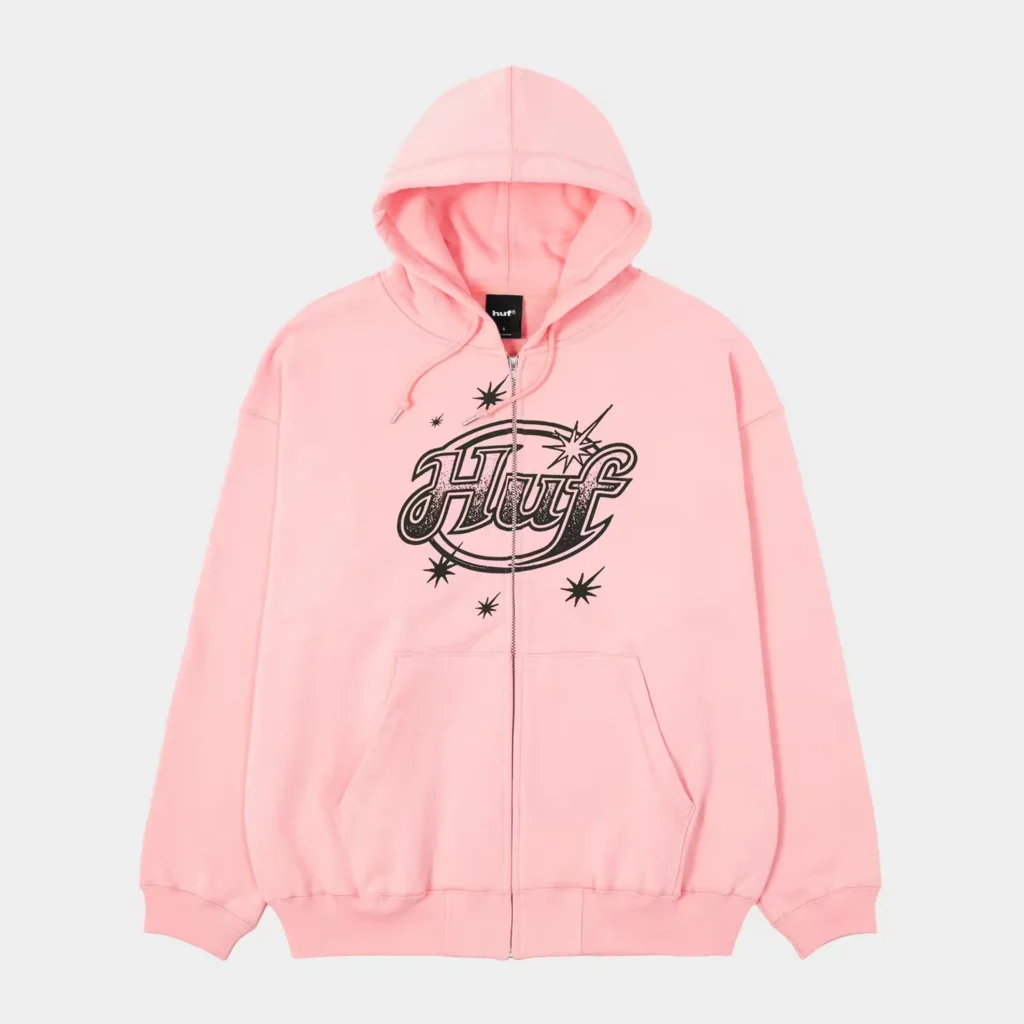 Pink HUF zip-up hoodie with hood, front pockets, black logo and starburst graphics on a light gray background