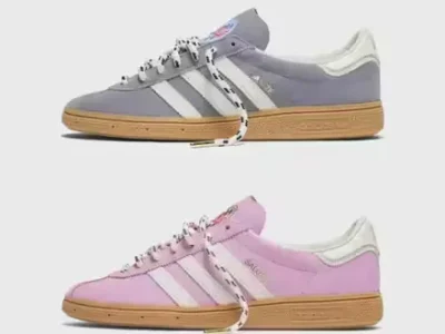 Two Adidas sneakers in grey and pink with white stripes, gum soles, and loose laces, arranged on a light background