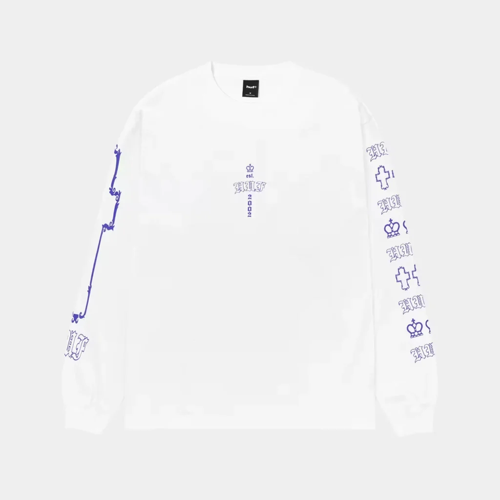 White long-sleeve HUF shirt with blue gothic lettering and symbols along the sleeves and chest, shown against a light