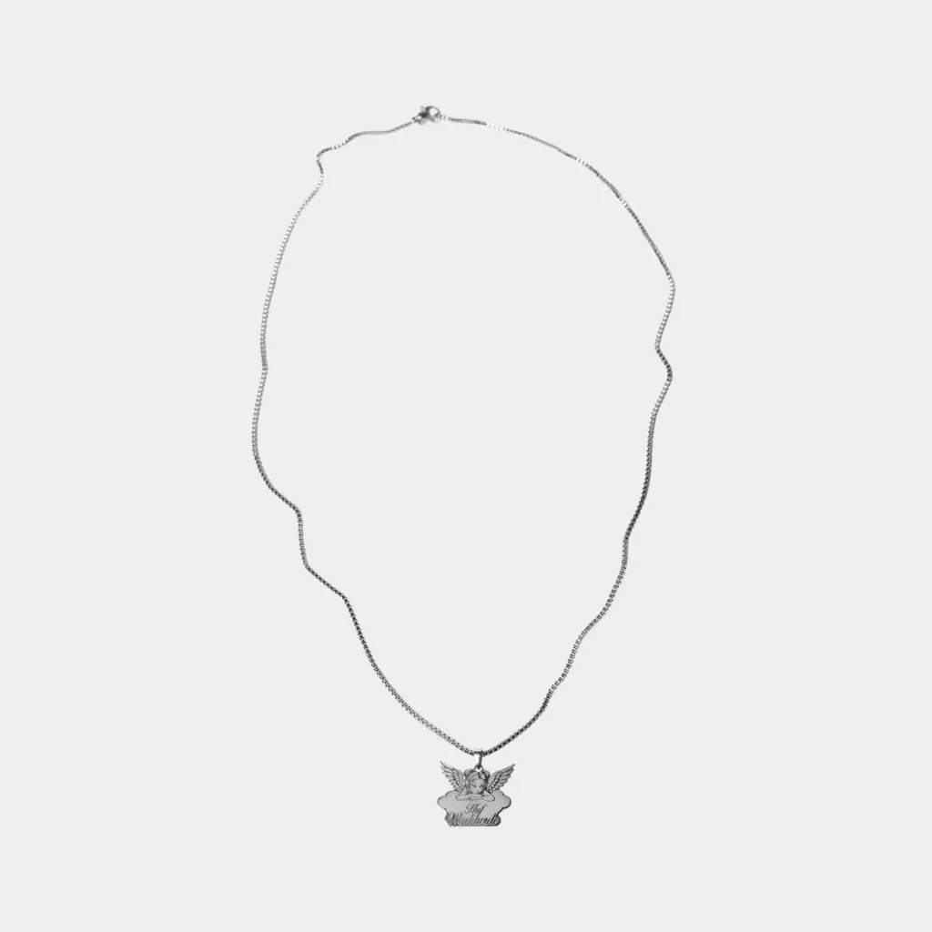 Silver-tone chain necklace with a winged angel pendant and “HUF Worldwide” lettering, isolated on a white background