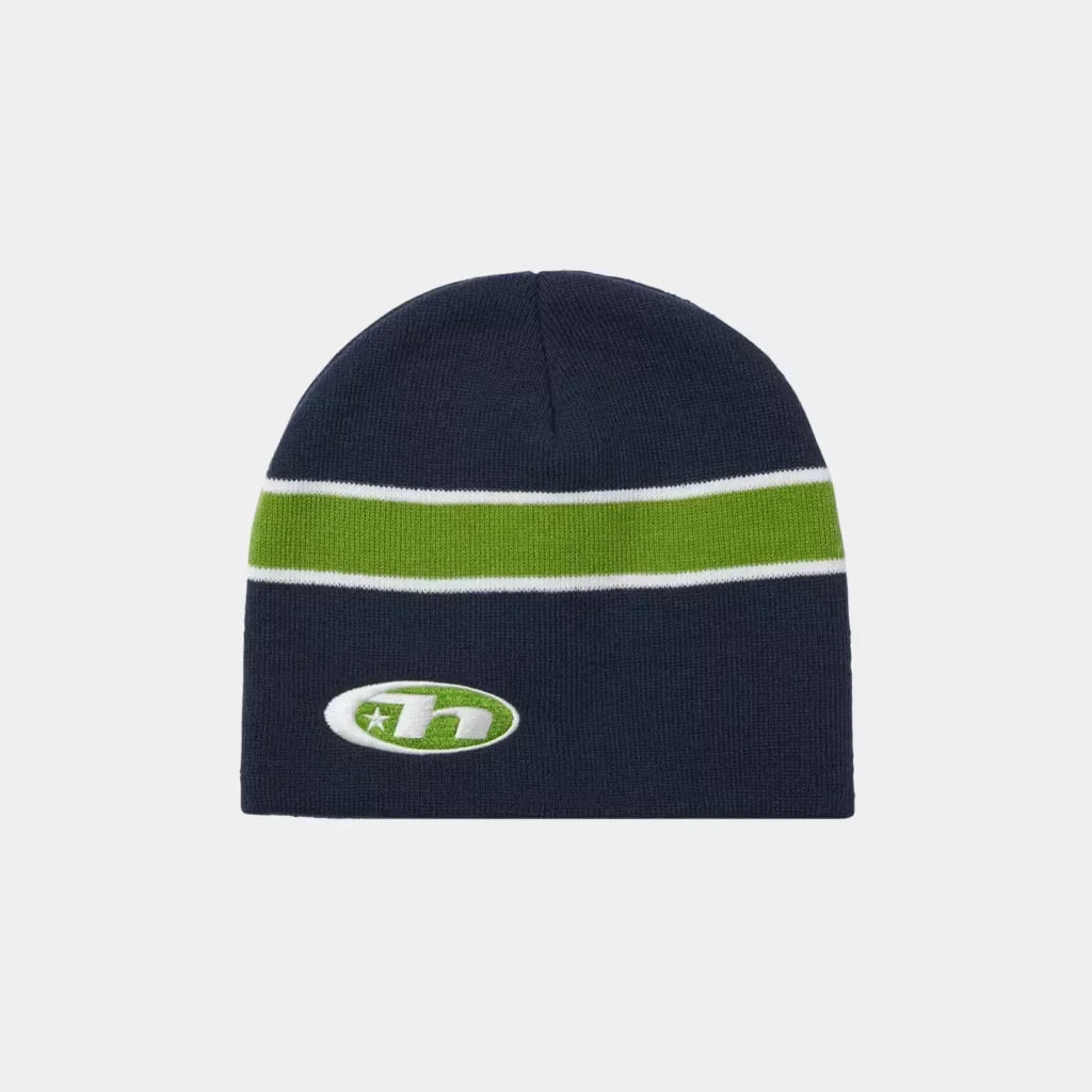 Navy knit beanie with a green stripe bordered in white and an embroidered oval logo, centered on a light background