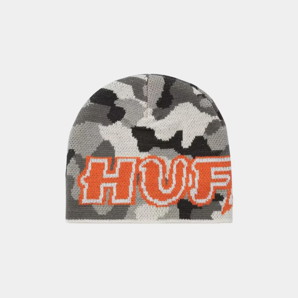 Gray camouflage knit HUF beanie with large orange-and-white HUF lettering, centered against a light gray background