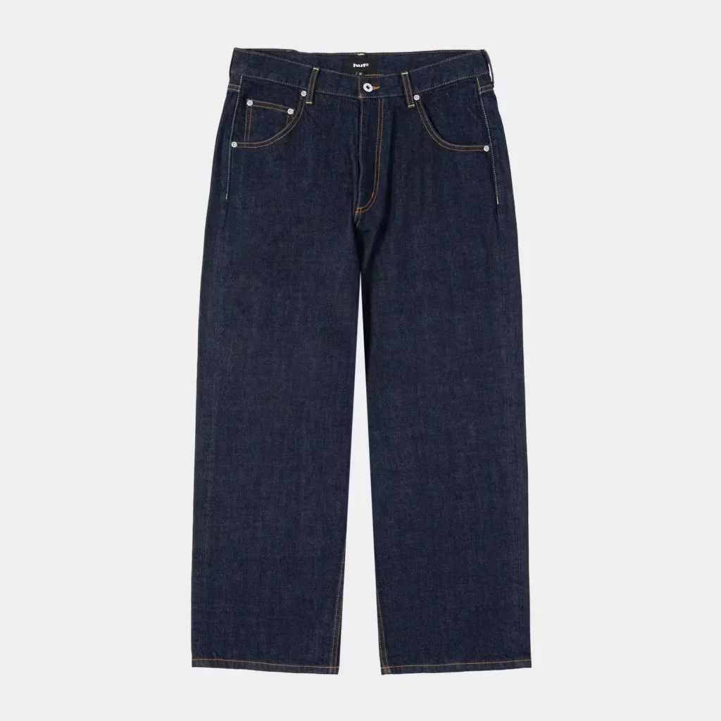 Dark indigo wide-leg jeans with contrast stitching, five pockets, and a button fly on a light background