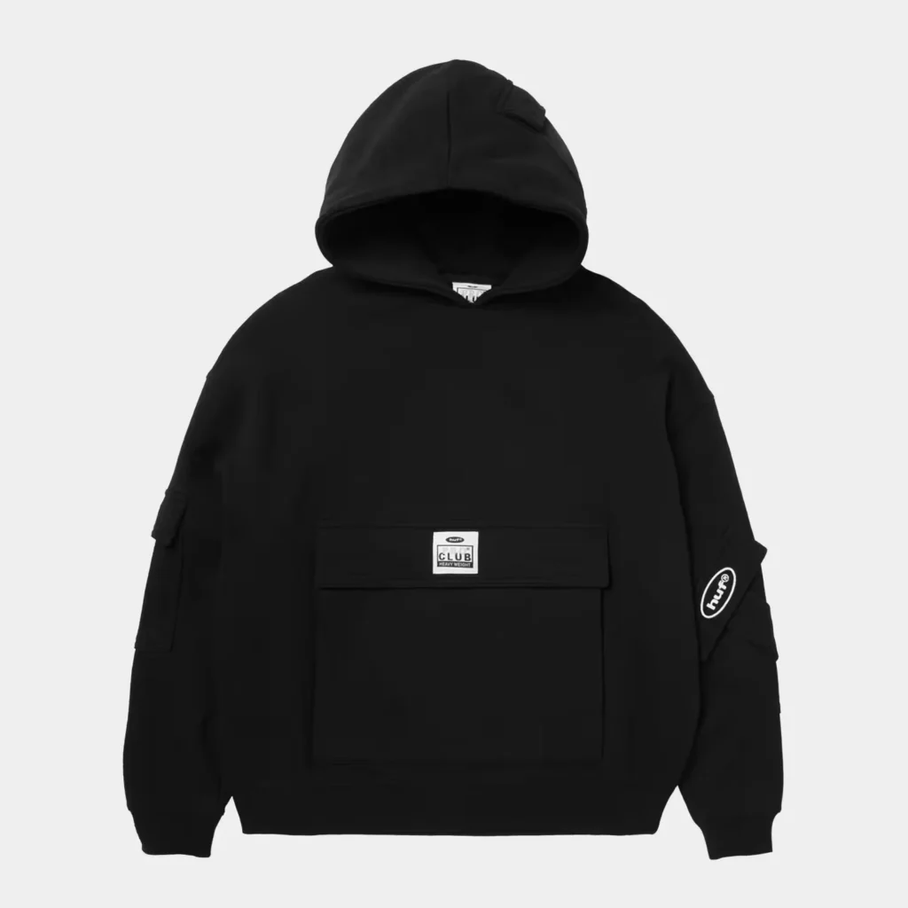 Black HUF pullover hoodie with a large front pouch pocket, sleeve patches and a raised hood against a white background