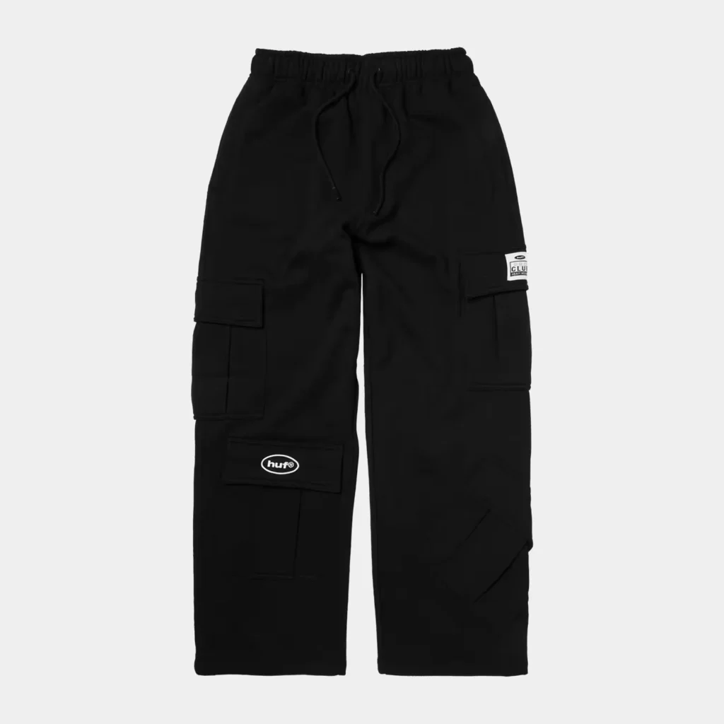 Black cargo pants with elastic waistband, drawstring, multiple flap pockets and HUF logo, shown against a light background