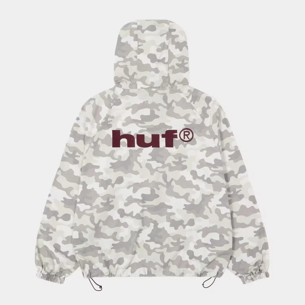 White and gray camouflage HUF hooded jacket with burgundy chest logo, elastic cuffs and drawcord hem on a plain background