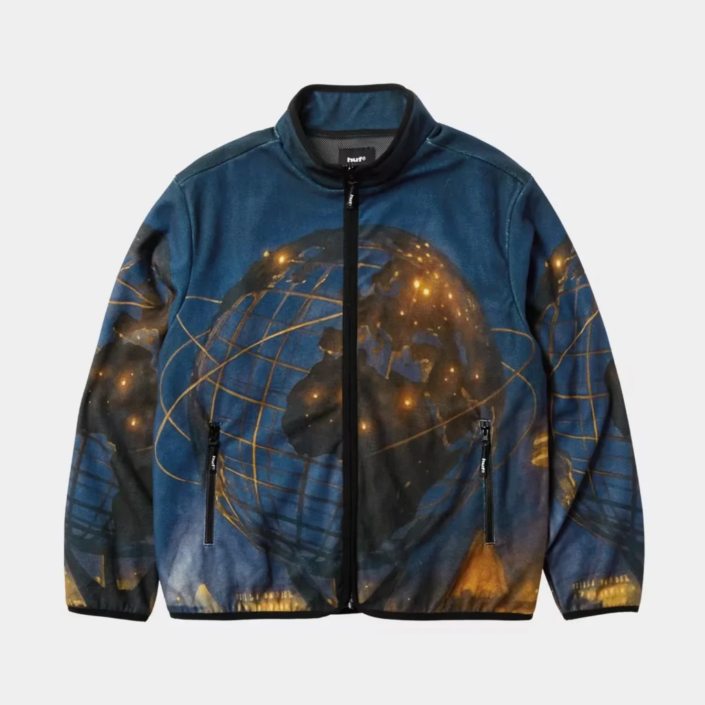 Blue HUF zip-up jacket with an all-over dark Xenomorph graphic and glowing orange-yellow accents against a plain background