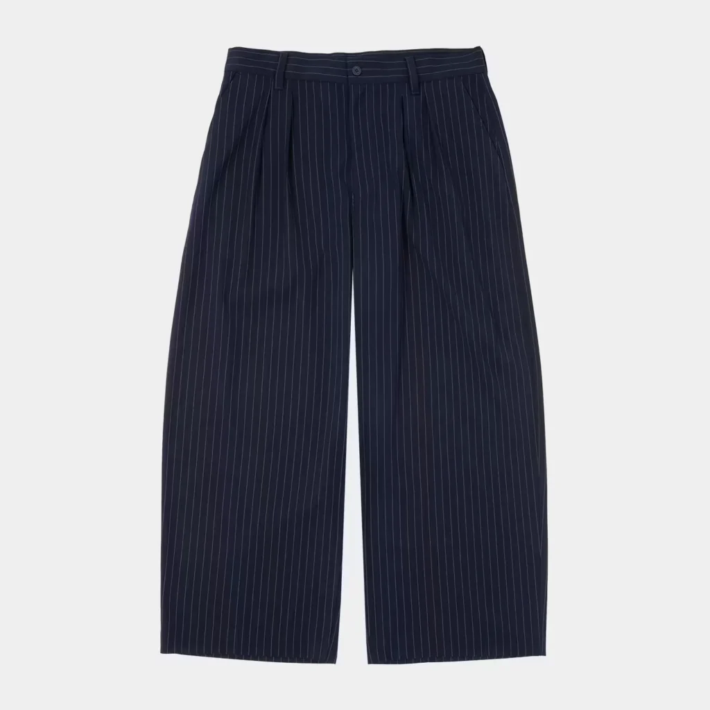 Navy pinstriped wide-leg trousers with pleats, belt loops, button closure, and angled pockets on a white background