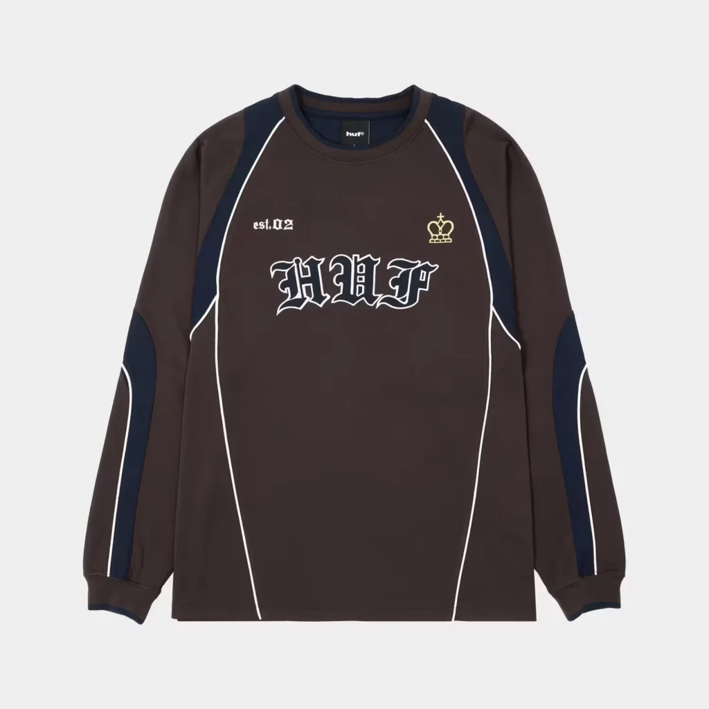 Brown and navy HUF long-sleeve shirt with white piping, gothic HUF logo, “est. 02” text and crown graphic