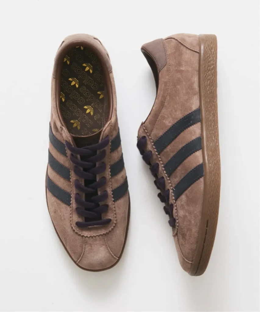 Pair of brown suede adidas Tobacco sneakers with black stripes and laces, shown from top and side on white background
