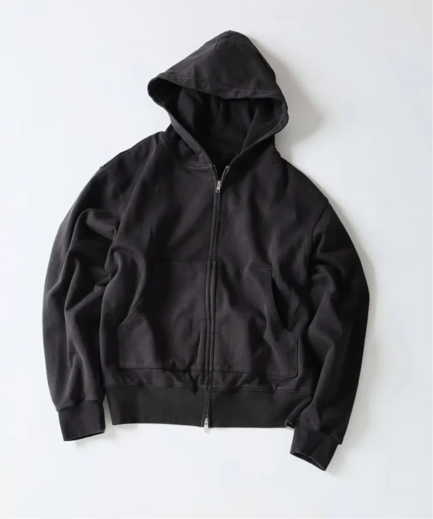 Black leather-look zip-up hoodie with drawless hood, kangaroo pockets and ribbed cuffs laid flat on a white background