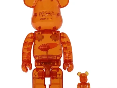 Large and small translucent orange bear-shaped figures standing side by side on a white background