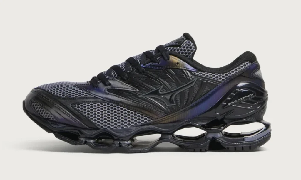 Black and dark purple Mizuno Wave Prophecy shoe with mesh panels and a segment elevated sole on a light background