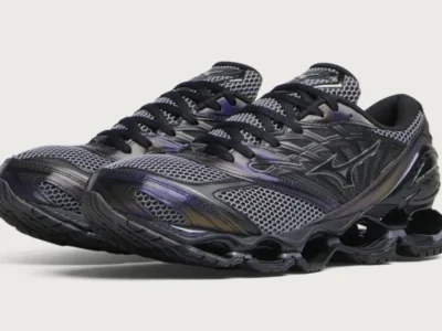 Pair of black and gray mesh shoe with thick sculpted soles, shown overlapping against a light gray background