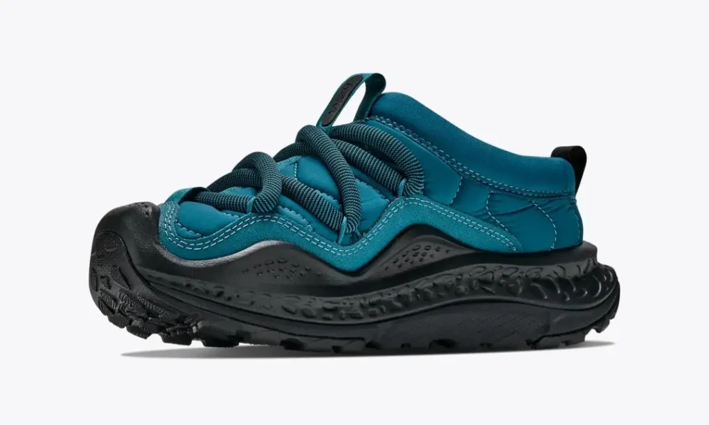 Teal Hoka Ora Primo shoe with black laces, thick textured sole, and padded collar on a white background