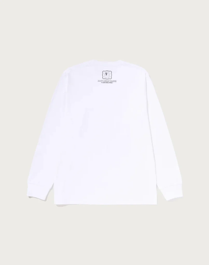 White long-sleeve shirt laid flat, with a small bear graphic and text printed on the upper chest against a pale background