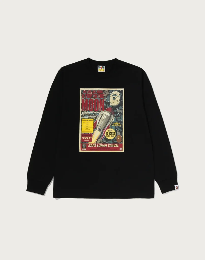 Black long-sleeve shirt with a colorful vintage-style rocket and moon graphic, displayed flat against a light background