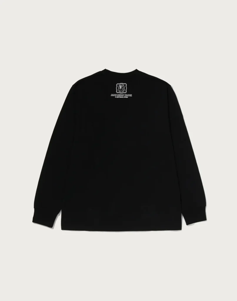 Black long-sleeve shirt laid flat, featuring a small white bear graphic and “BAPE LUNAR TRAVEL” text on the chest