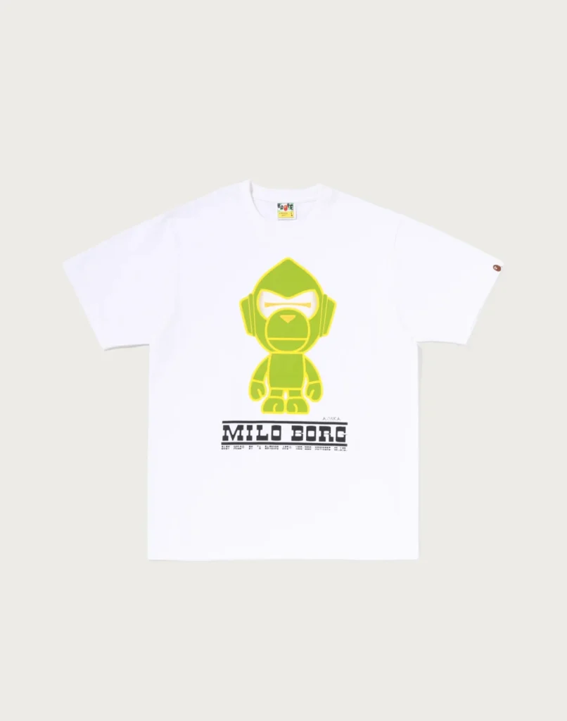 White T-shirt featuring a lime-green robot graphic and bold black “MILO BORG” text, laid flat on a pale background