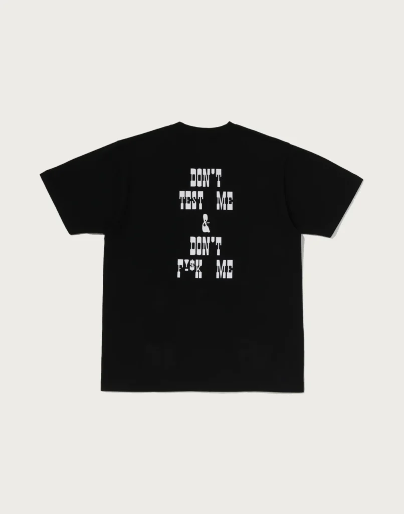 Black T-shirt laid flat on a light background, featuring stacked white text reading “DON’T TEST ME & DON’T F**K ME”