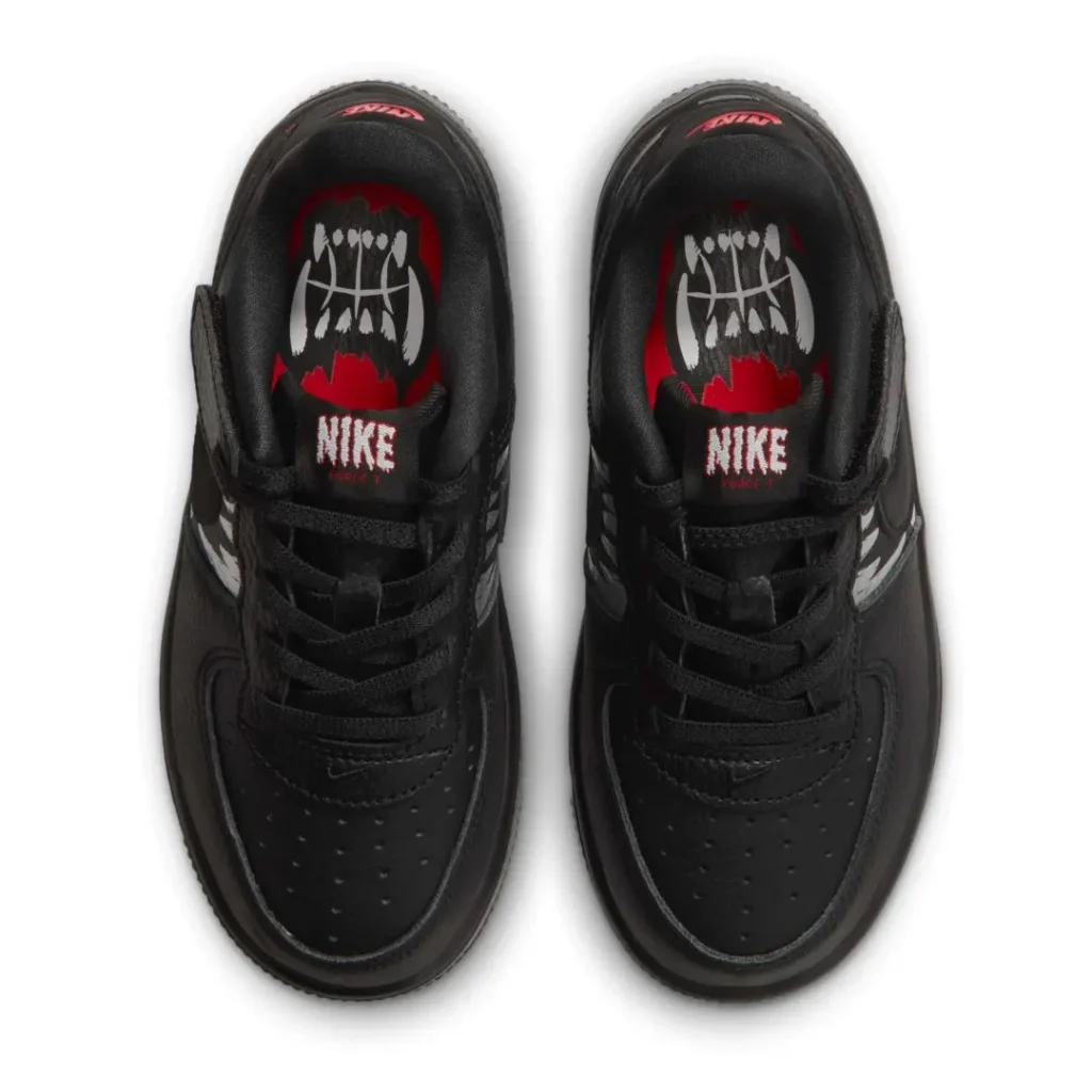 Pair of black Nike shoe shown from above, with red-and-white graphic insole and black lace on a white background