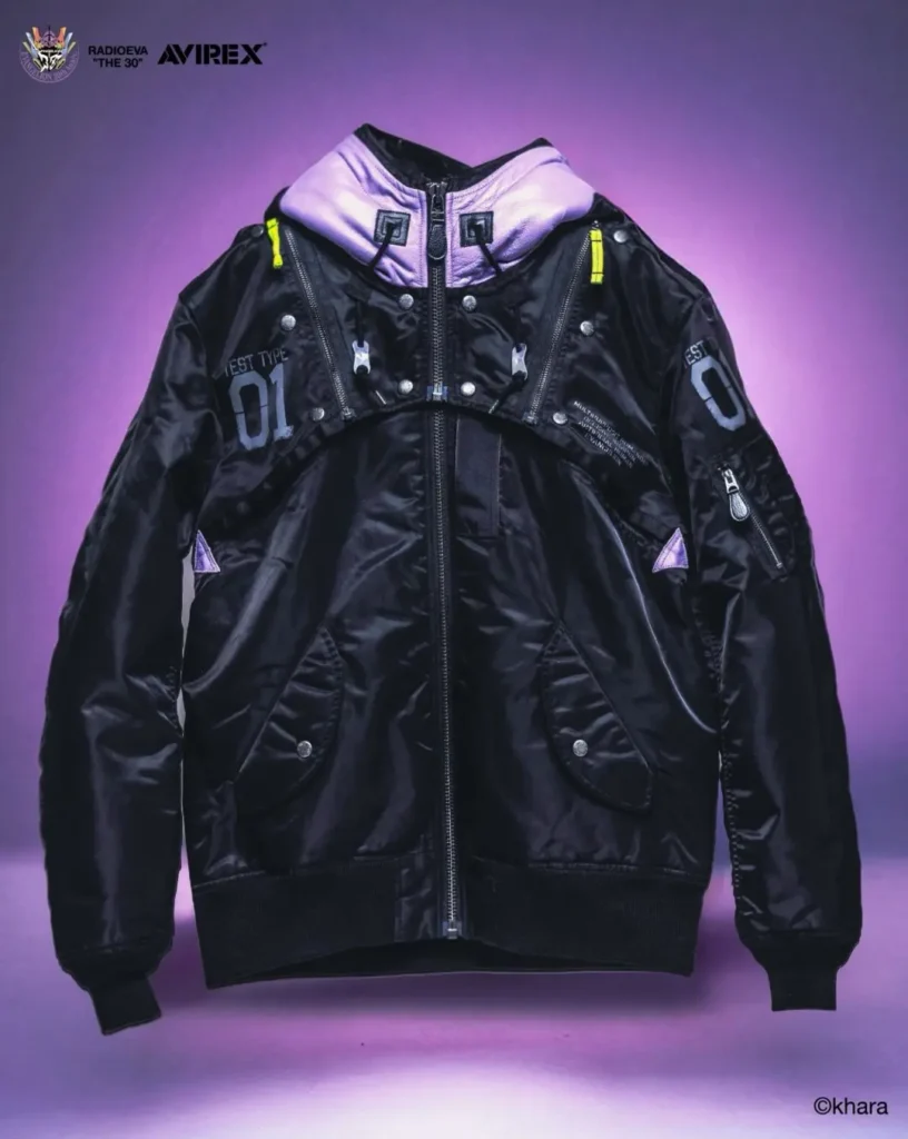 Black MA-1 bomber jacket with lavender hood, yellow zipper pulls and gray “01” markings against a purple backdrop