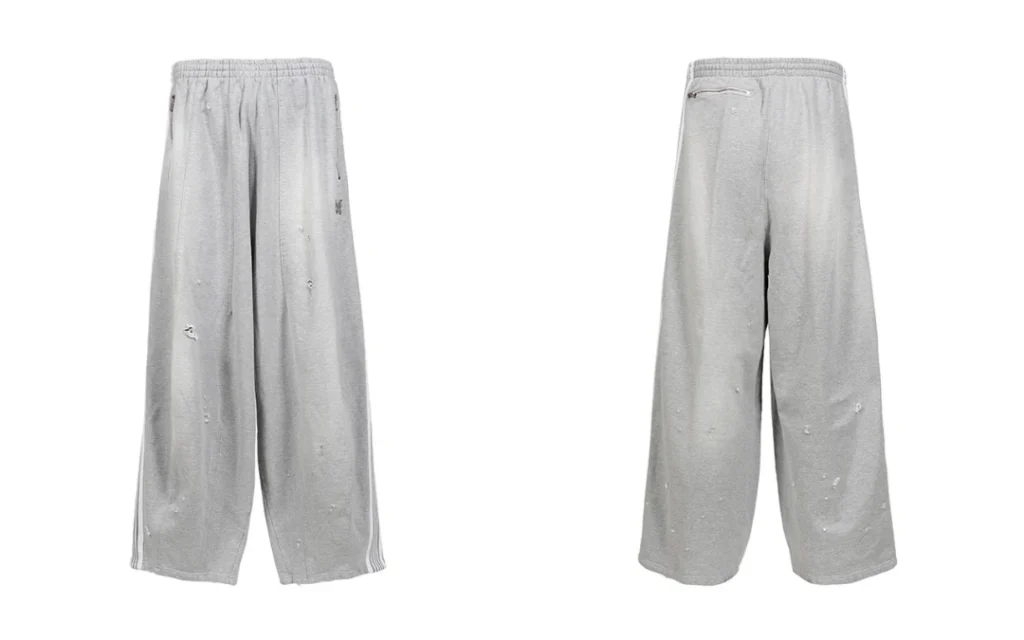Front and back views of light gray distressed cotton jersey track pants on a white background