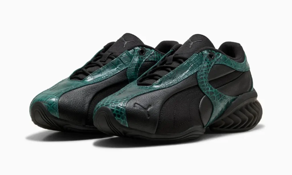 Pair of black shoe with dark green crocodile-textured overlays, shown at an angle on a white background