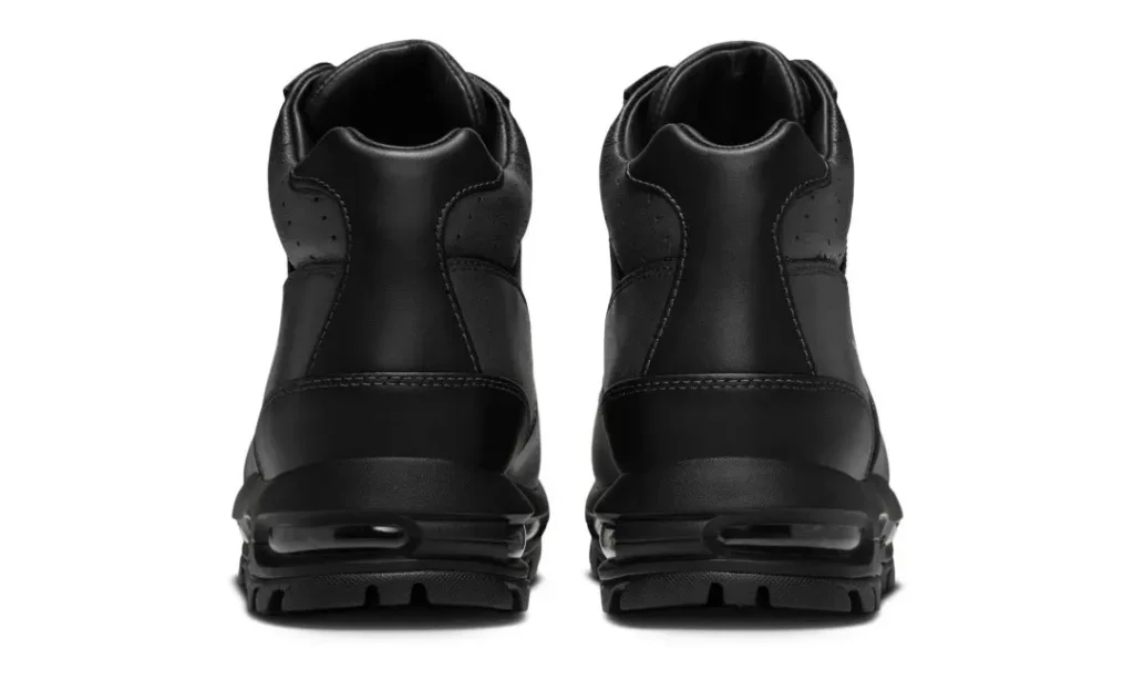 Pair of black leather high-top sneakers shown from the rear on a white background, with air-cushioned soles