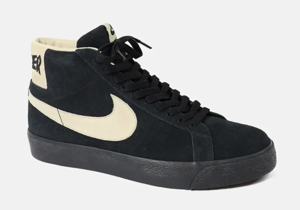 Black high-top sneaker with cream swoosh, collar lining and heel panel, shown against a light gray background
