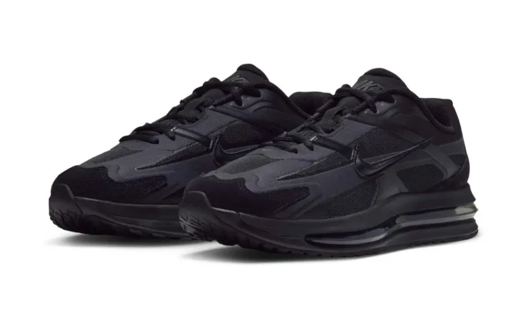 Pair of black Nike Air Max shoe with mesh and synthetic panels, angled on a white background