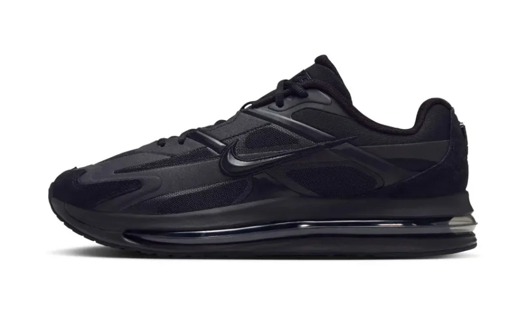 Black Nike Air Max sneaker in side profile, featuring mesh panels, a layered upper, and a visible air cushion sole