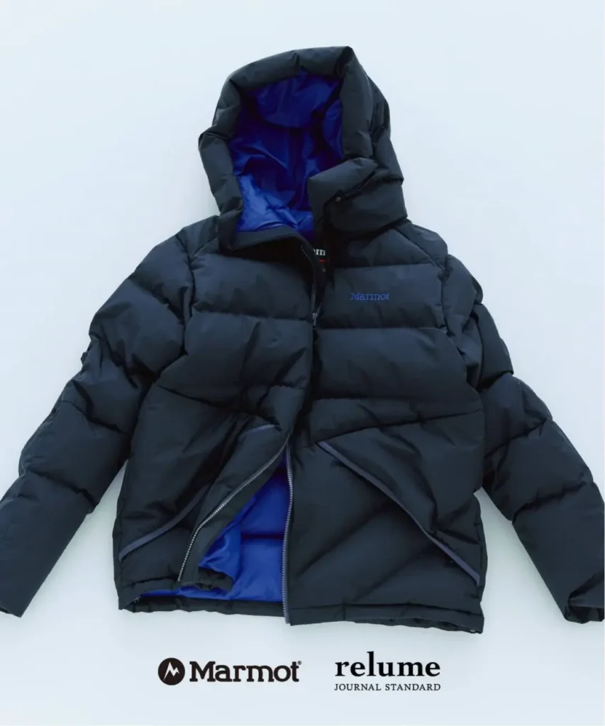 Black Marmot puffer jacket with a blue-lined hood, laid flat on a white background beside Marmot and relume logos