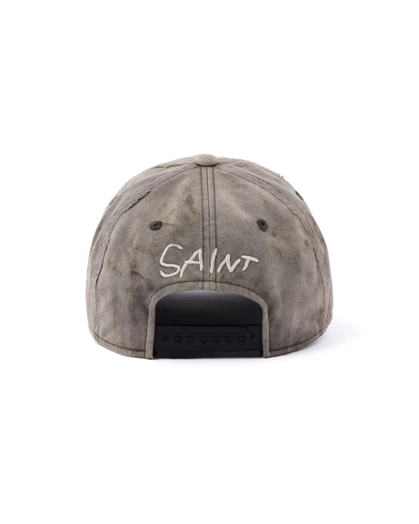 Distressed gray snapback cap with white “SAINT” embroidery, shown from the back against a white background