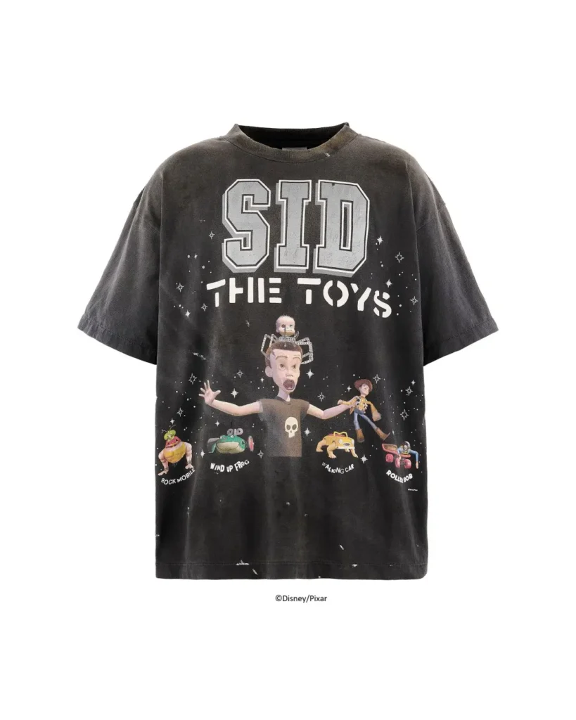 Black distressed T-shirt with large “SID THE TOYS” graphic and colorful toy characters on a white background
