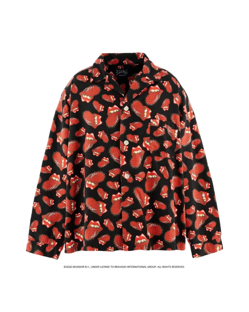 Black long-sleeved shirt with white buttons, patterned with red spiky cartoon faces, displayed against a white background