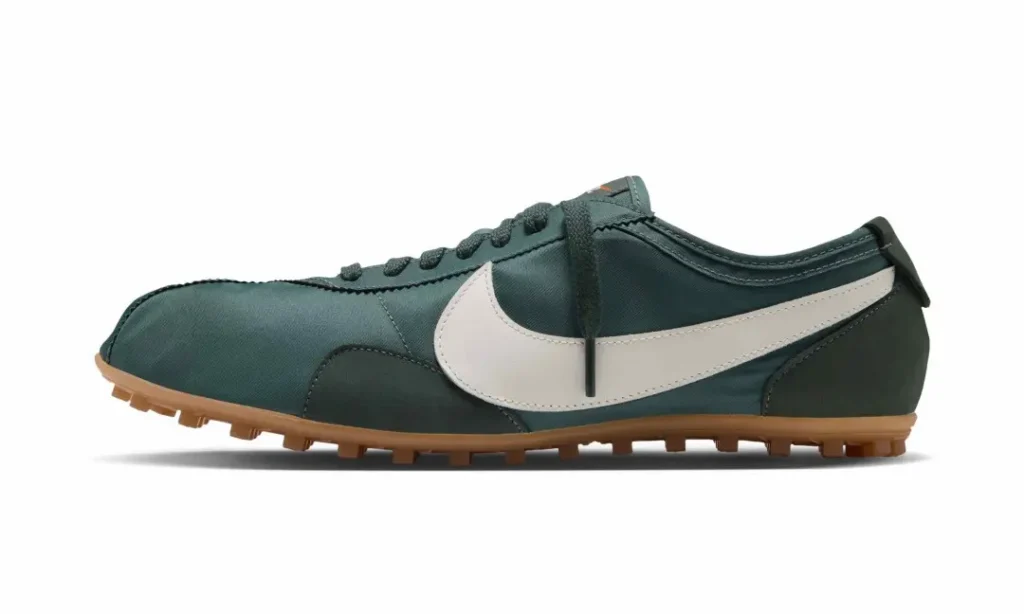 Dark green Nike sneaker with a white swoosh and gum-colored lugged sole on a white background