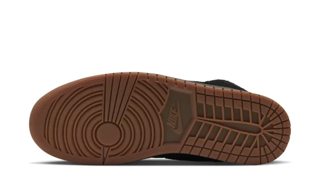 Brown Nike shoe outsole with concentric circular grooves, rectangular tread blocks, and visible Nike logo against a white